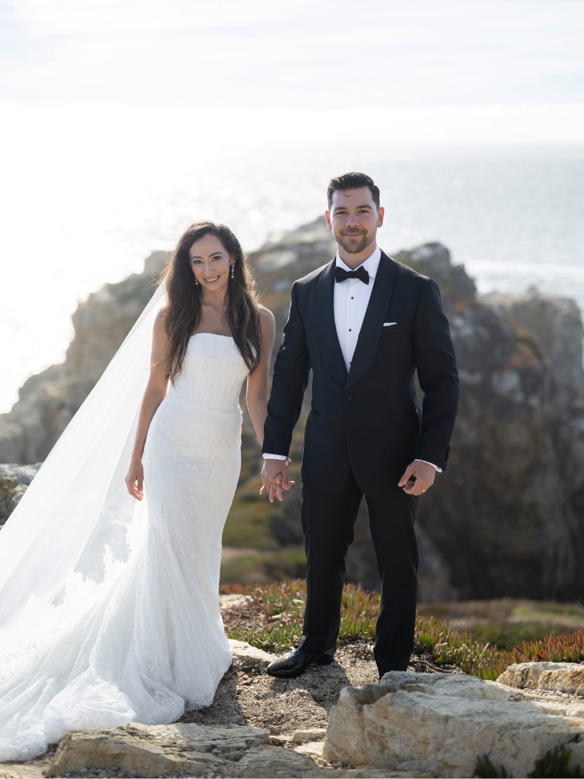 Ruben and Janeza facing the camera together on the coast